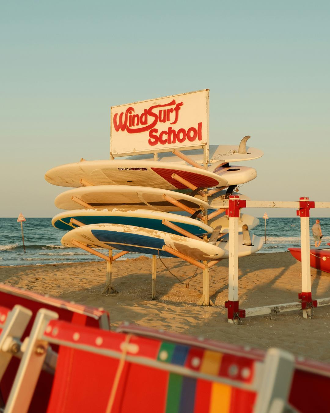 colorful sun loungers on the beach, surf boards, the sea — it means summer goes well, right?